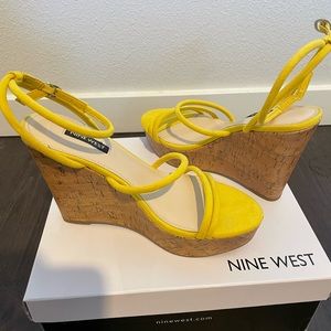 Brand new. Never worn. Nine West cork platform heel.